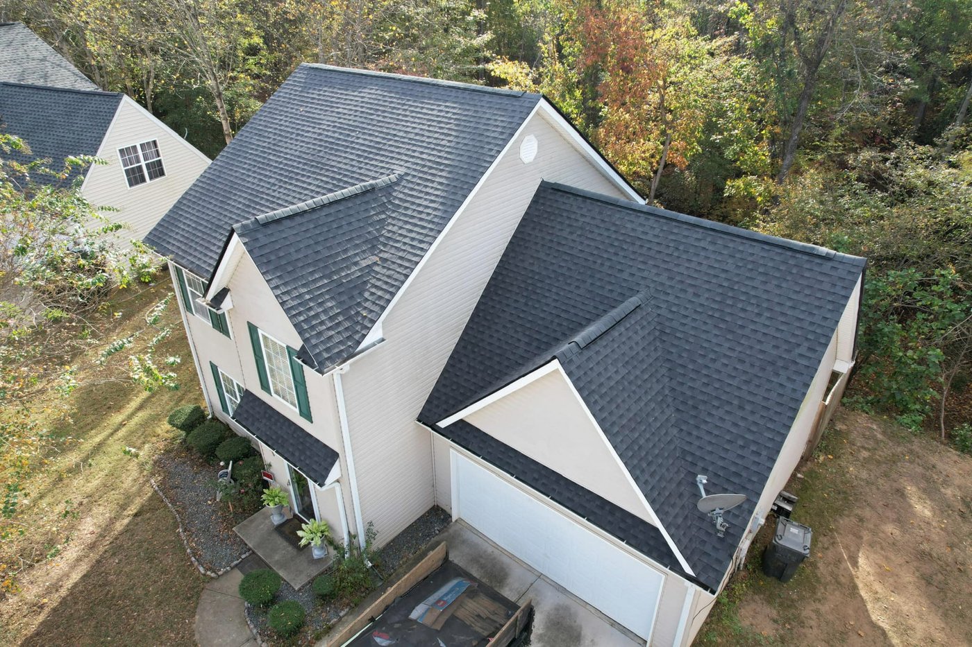 Drone view of a two-story home with steep gables, Upstate SC