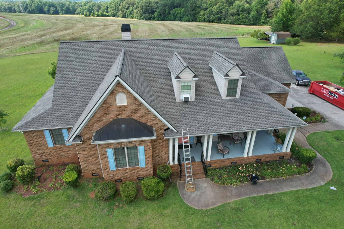 Brick home with dormers and a covered front porch, Upstate SC